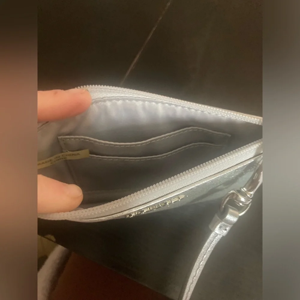 Coach Vintage glittery silver skinny zip wristlet wallet. Good used condition